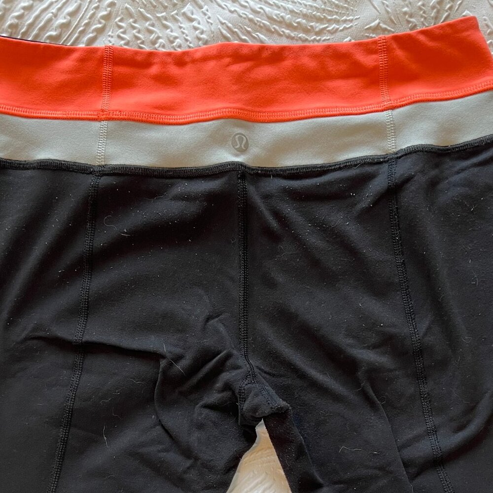 Women's Lululemon Reversible Black, Coral Leggings Size 6 Used/Fair Condition - Picture 2 of 7